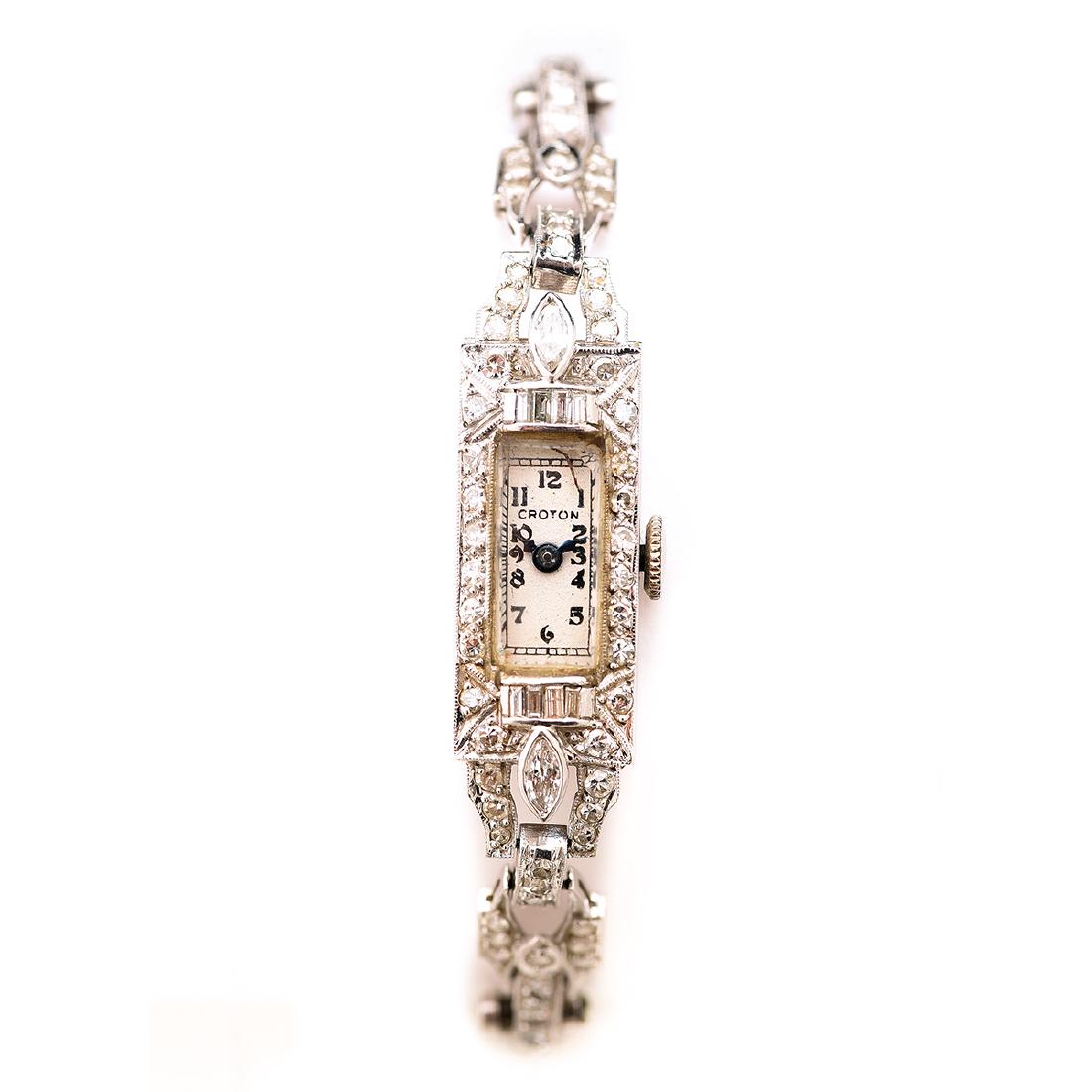 Ladies Croton Diamond, Platinum, 14k White Gold: Ladies Croton Diamond, Platinum, 14k White Gold Wristwatch. DIAL: Geometric, white, black Arabic numeral hour markers, black outer minutes track, blued railway hands, Croton. MOVEMENT: Manual wind, se