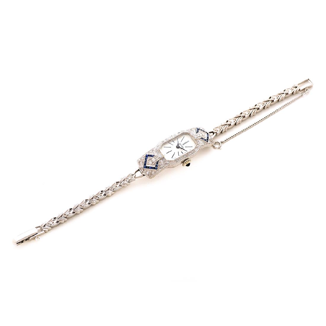 Ladies Diamond, Sapphire, Platinum, 14k White Gold: Ladies Diamond, Sapphire, Platinum, 14k White Gold Wristwatch. DIAL: Rectangle bezeled corn, white, black index hour markers, black spade hands, Gruen. MOVEMENT: Manual wind, fifteen (15) jewels, four