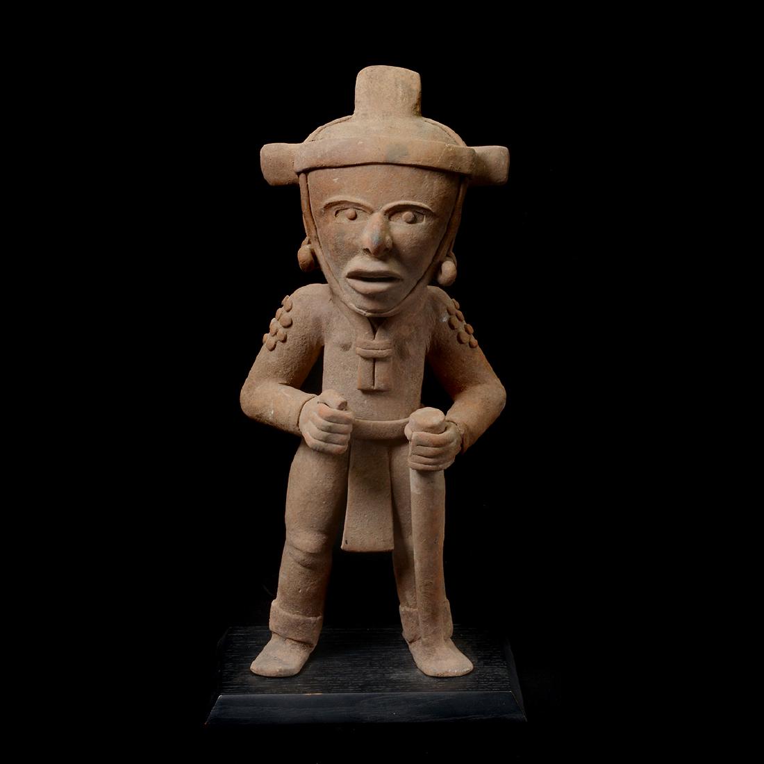 Remojades Standing Figure.: Remojades Standing Figure. Buff ceramic, standing male wearing breechcloth, necklace, earspools, chinstrap to headband; holding a thick staff, Mouth open as though vocalizing. Veracruz, Mexico. Circa 
