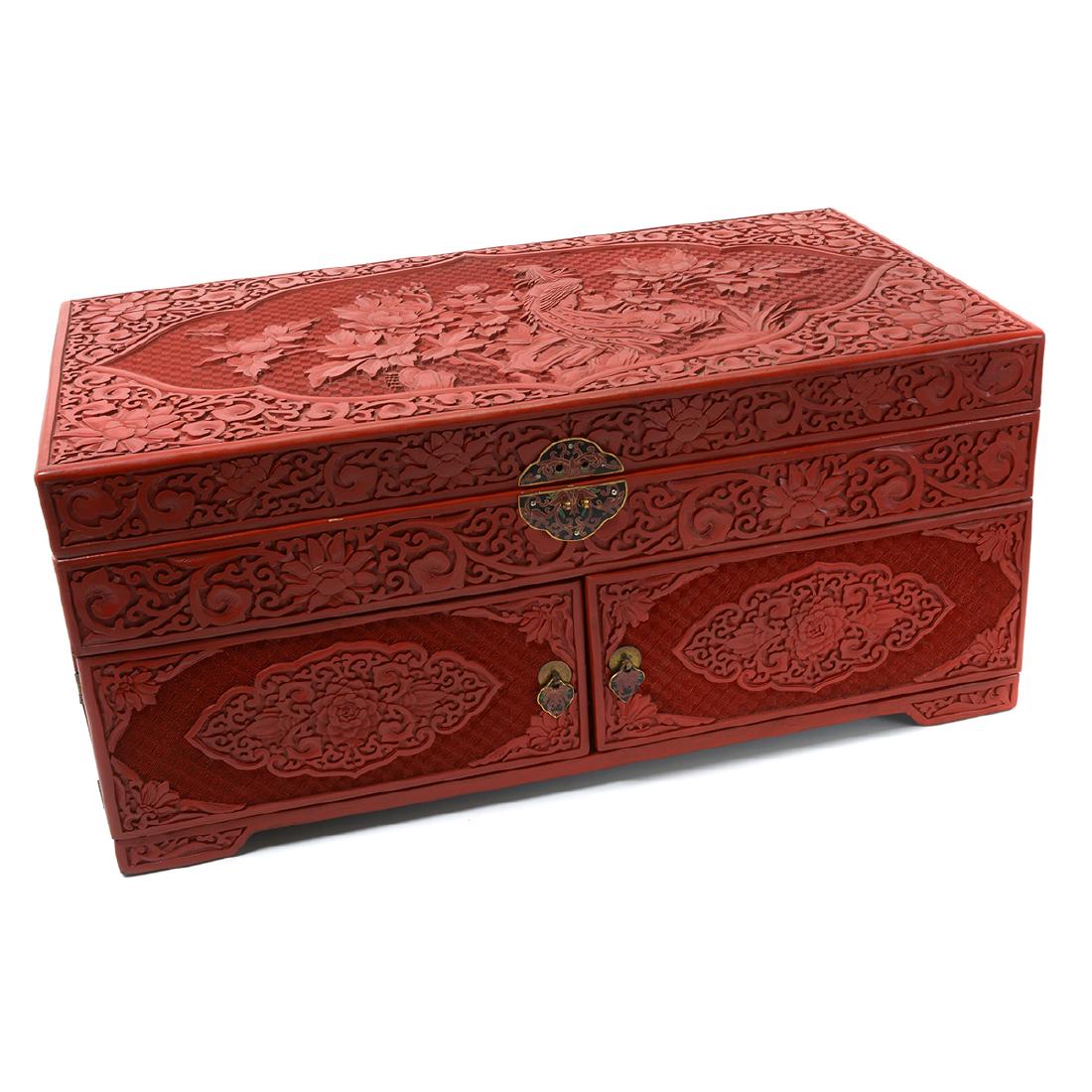 Cinnabar Lacquer Chest, 20th Century: Cinnabar Lacquer Chest With a hinged lid and doors revealing four drawers, decorated overall with flowers and diaper ground. 20th Century {10 x 22 1/4 x 12 1/4 inches (25.4 x 56.5 x 31.1 cm)}