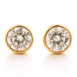 Tiffany Diamond, 18k Yellow Gold Stud Earrings: Pair of Tiffany & Co. Diamond, 18k Yellow Gold Stud Earrings. Each featuring one round brilliant-cut diamond weighing approximately 2.27 cts. and 2.25 cts., bezel set in an 18k yellow gold stud