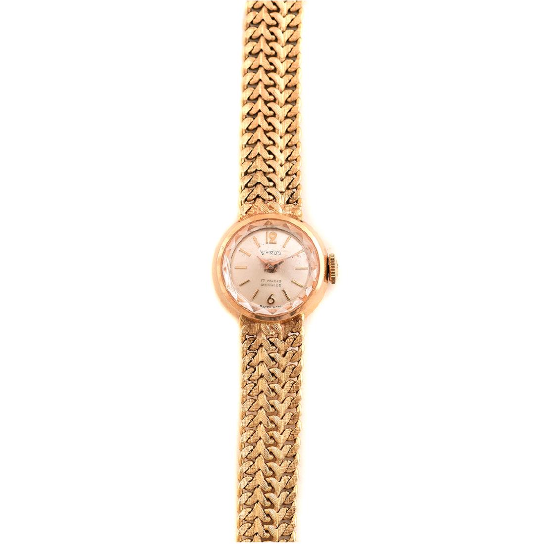 Ladies Venus 18k Yellow Gold Wristwatch.: Ladies Venus 18k Yellow Gold Wristwatch. DIAL: Round, silvered, gold Arabic numeral and index hour markers, gold dauphine hands, Venus, 17 Rubis, Incabloc, Swiss made. MOVEMENT: Manual wind, seventeen