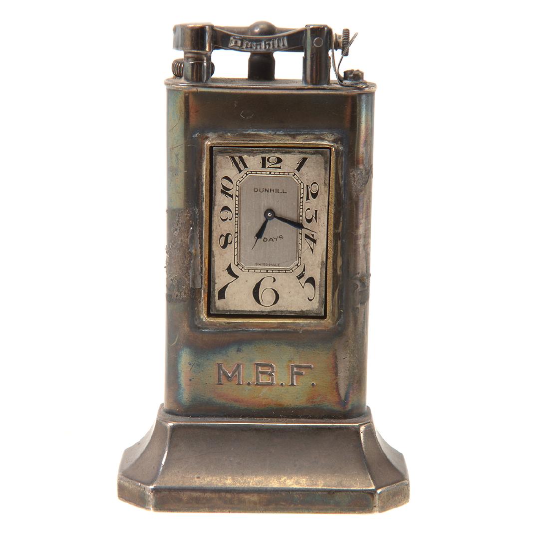 Art Deco Dunhill Table Lighter with Clock.: Art Deco Dunhill Table Lighter with Clock. Flattened cylinder form set in a wide base. Eight day clock with blued hands. M.B.F. monogram. Pat. No. 143752, Unique Dunhill, Fabrique en Suisse, Made in S