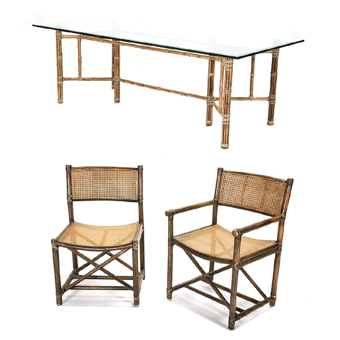 McGuire Dining Set: McGuire Dining Set. Composed of six side chairs, two armchairs, and a glass top dining table with a bamboo frame. Chairs have caned seats and backs with bamboo style frames. McGuire San Francisco badg