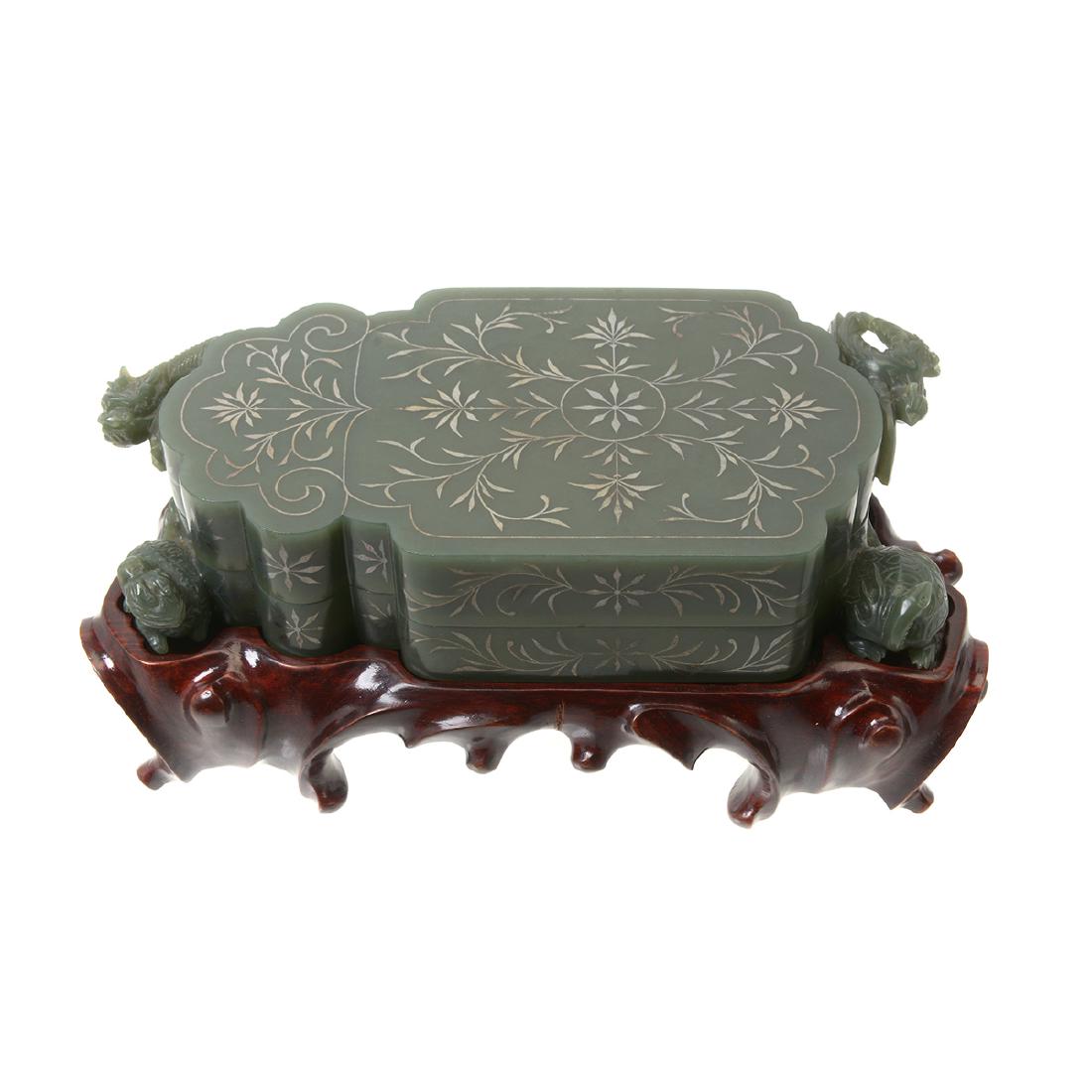Mughal Style Carved Spinach Jade Box with Cover: Mughal Style Carved Spinach Jade Box with Cover. Accompanied by a fitted wood stand and box. {Width: 6 3/4 inches (17 cm)}.