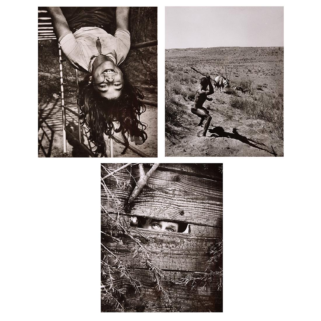 3 time life photos, Farbman, W.E. Smith and Doisneau: ROBERT DOISNEAU, N.R. FARBMAN and W. EUGENE SMITH (French 1912-1994), (1907-1988) and (American 1918-1978) "Eyes through Fence", "The Hunter", "Portrait of Child" Gelatin silver print. Sheet: 12 7/8 x