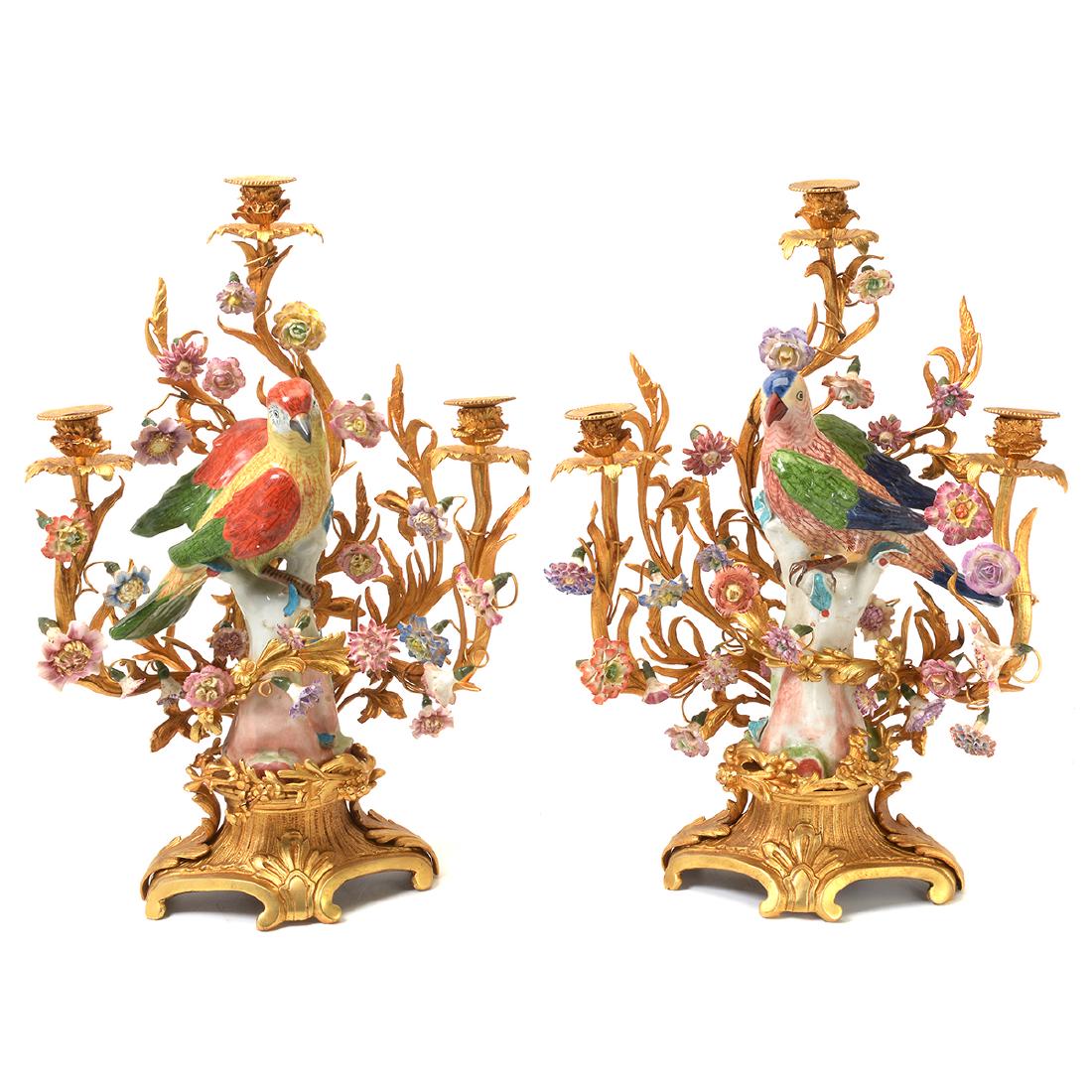 Pair of Dore Bronze and Polychrome Porcelain Three: Pair of Dore Bronze and Polychrome Porcelain Three Light Candelabras. Parrot motif. Crossed swords mark. {Approximate dimensions: 20 1/2 tall x 13 1/2 inches wide.}