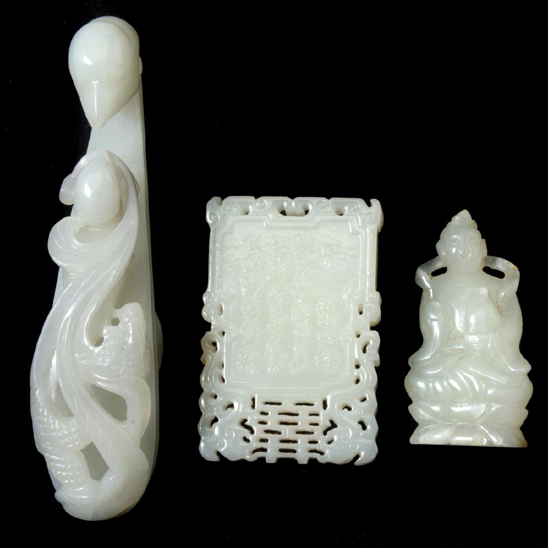 Three Chinese Jade Accessories: Three Chinese Jade Accessories. Comprising a rectangular pendant, a guanyin pendant, and a jade belt hook. {Length of belt hook: 4 1/4 inches (10.8 cm)}.
