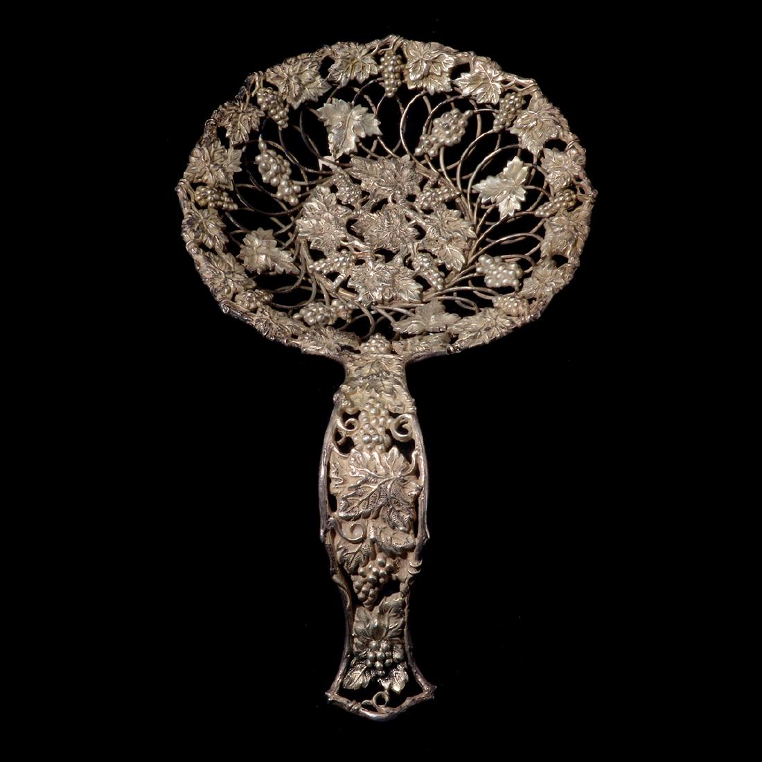 Theodore B. Starr Sterling Silver Decorative Strainer: Theodore B. Starr Sterling Silver Decorative Strainer. Decorated with a grapevine motif. Marked on underside Theodore B. Starr, Sterling, 2587. New York. Late 19th/early 20th century. {Weighable silve