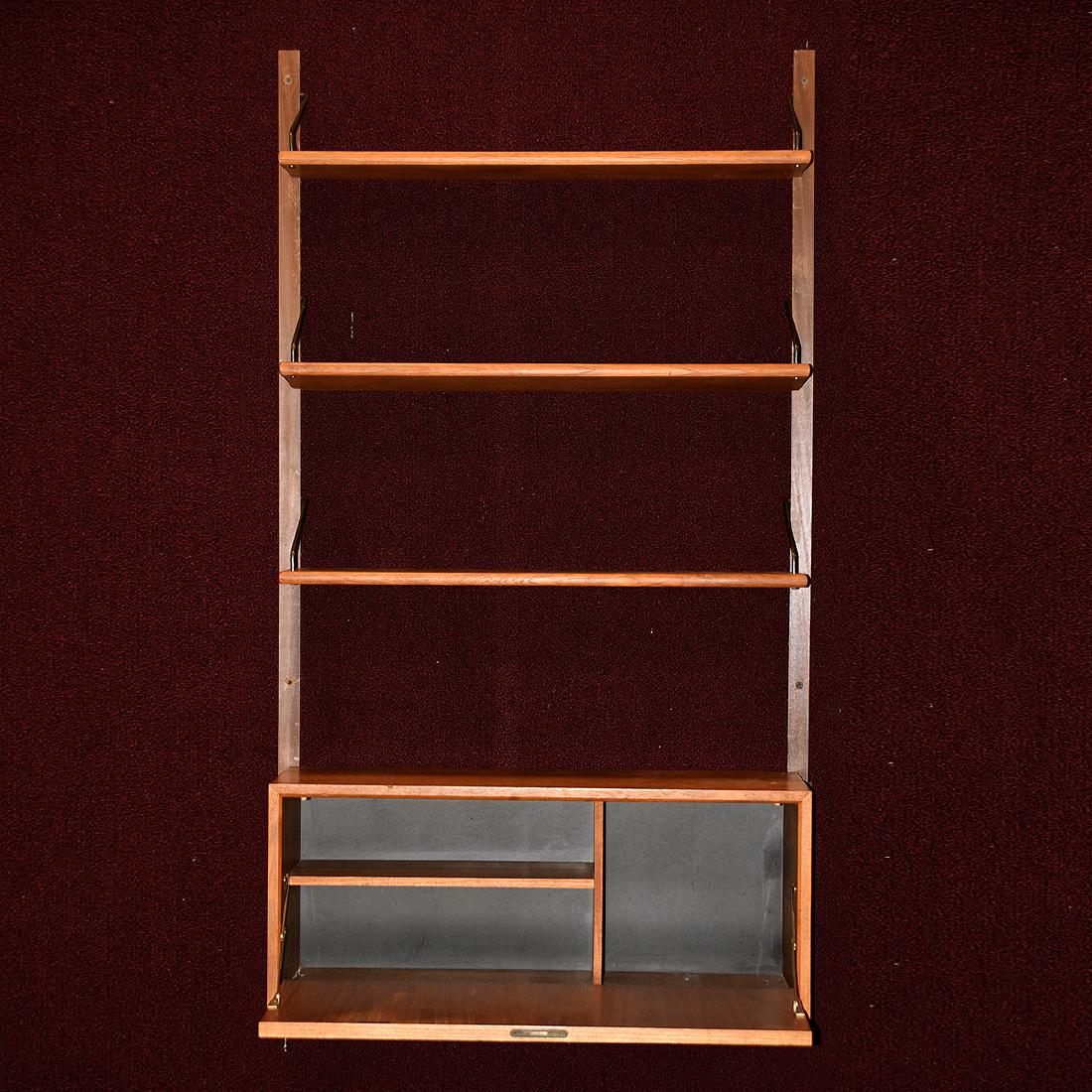 Danish Teak Mid-Century Modern Wall Unit: Danish Teak Mid-Century Modern Wall Unit. Three shelves set above a single door cabinet. {Approximate dimensions: 59 high x 33 wide x 12 inches deep.} Condition: Dent to cabinet door by escutcheon. Sc