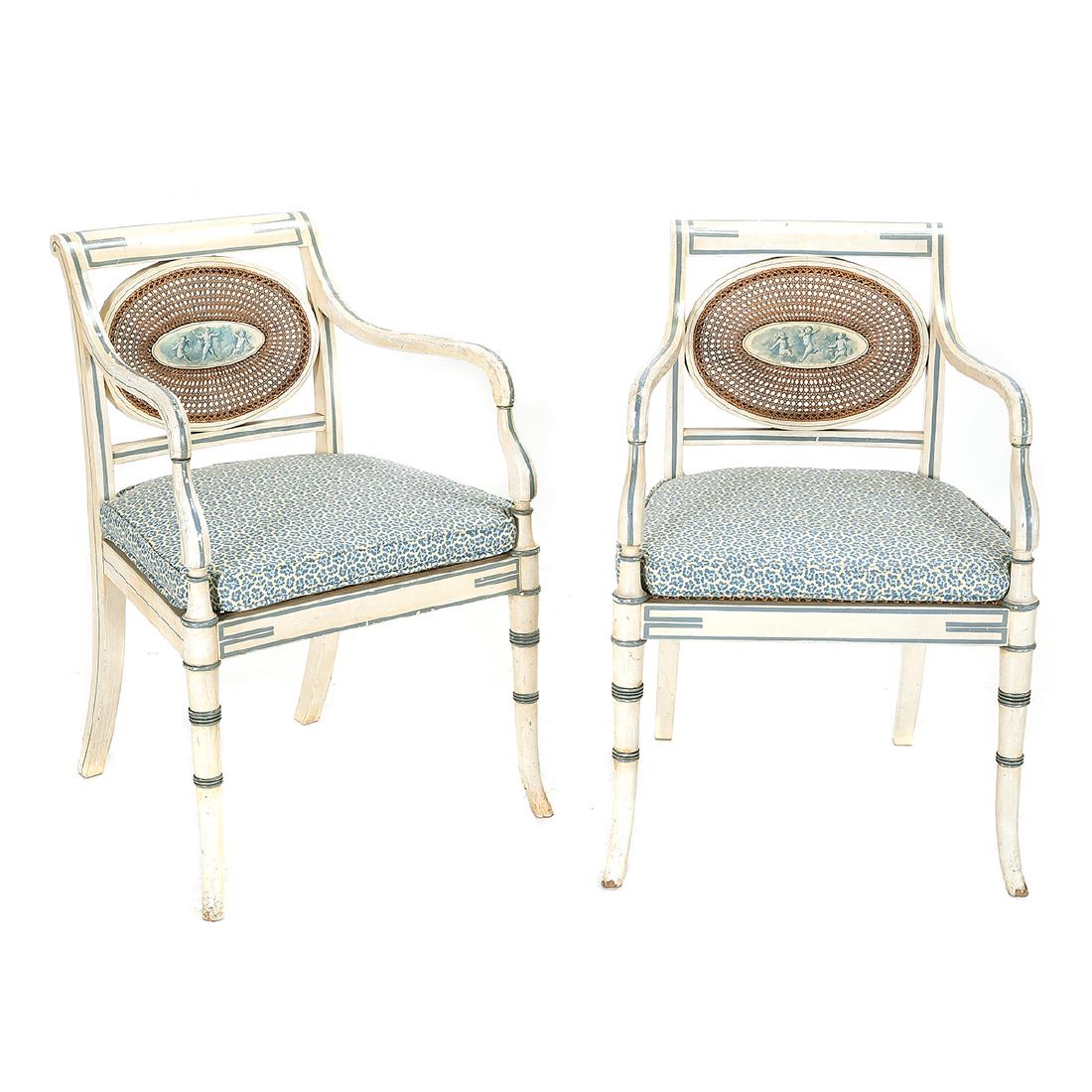 Set of Four Neoclassical Style Chairs with Caned Backs: Set of Four Neoclassical Style Chairs with Caned Backs and Seats. White painted frames with blue trim. Caned back section surrounds small paintings of putti. Upholstered cushion seats in blue and whit