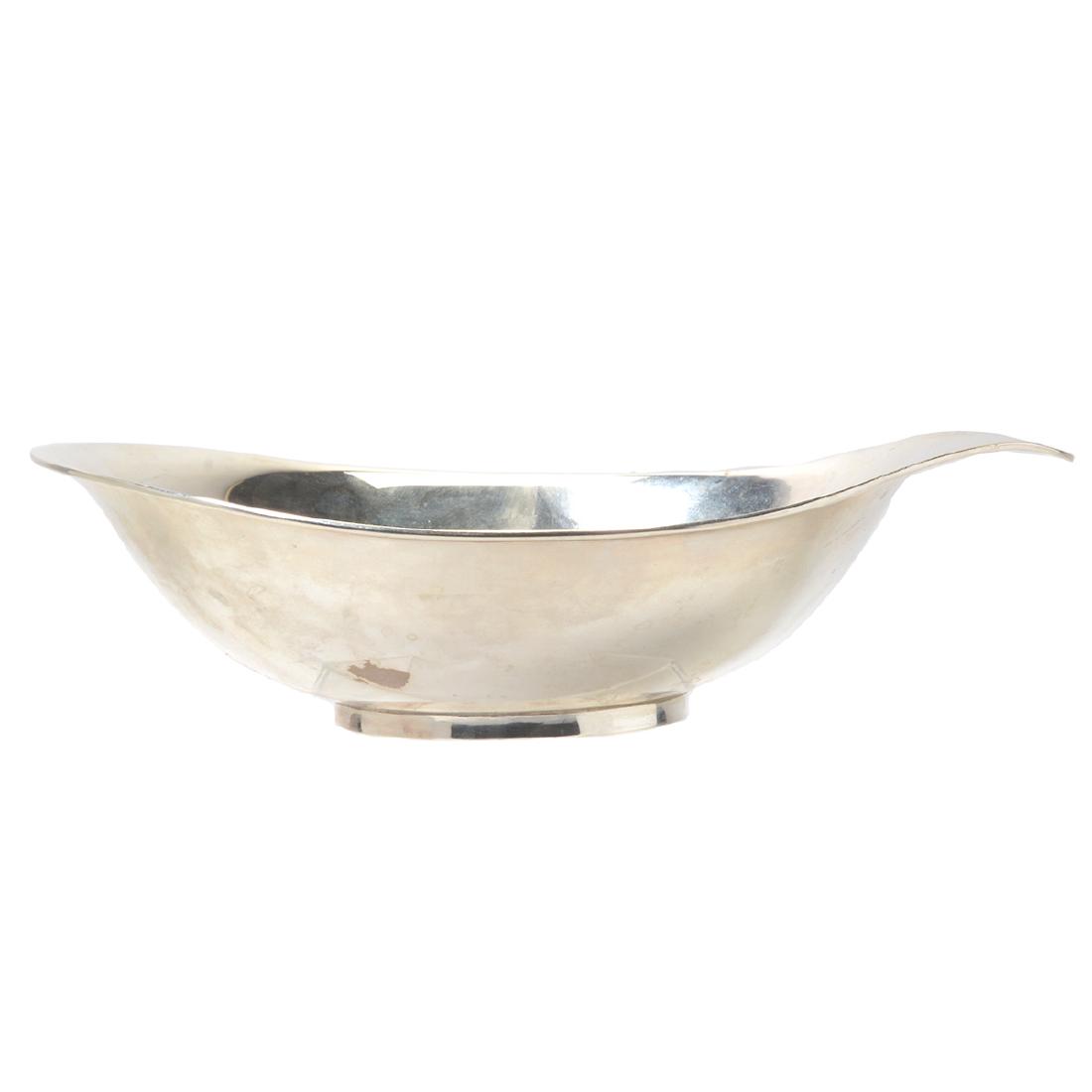 Mid-Century Modern Allan Adler Sterling Silver Bowl: Mid-Century Modern Allan Adler Sterling Silver Bowl. Round bowl which flares at one end providing a handle. Marked under handle: Allan Adler, Sterling. California, USA. {Approximate weighable silver: