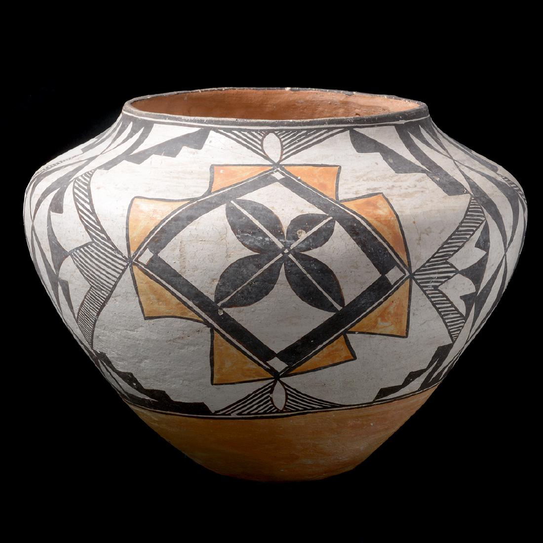 Native American Acoma Pottery Painted Vessel: Native American Acoma Pottery Painted Vessel. Wide mouthed vase, which bulges towards the top and tapers towards the bottom. Black and tan painting on white. No markings. Acoma Pueblo, New Mexico. {Ap