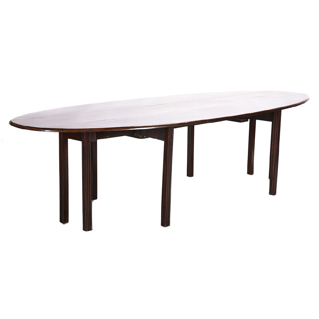 Irish Victorian Mahogany Drop Leaf Wake Table: Irish Victorian Mahogany Drop Leaf Wake Table drop-leaf table with slender center section and two d-shaped ends to the sides, forming an oval when opened. On straight, grooved gate legs. Anglo-Irish. 
