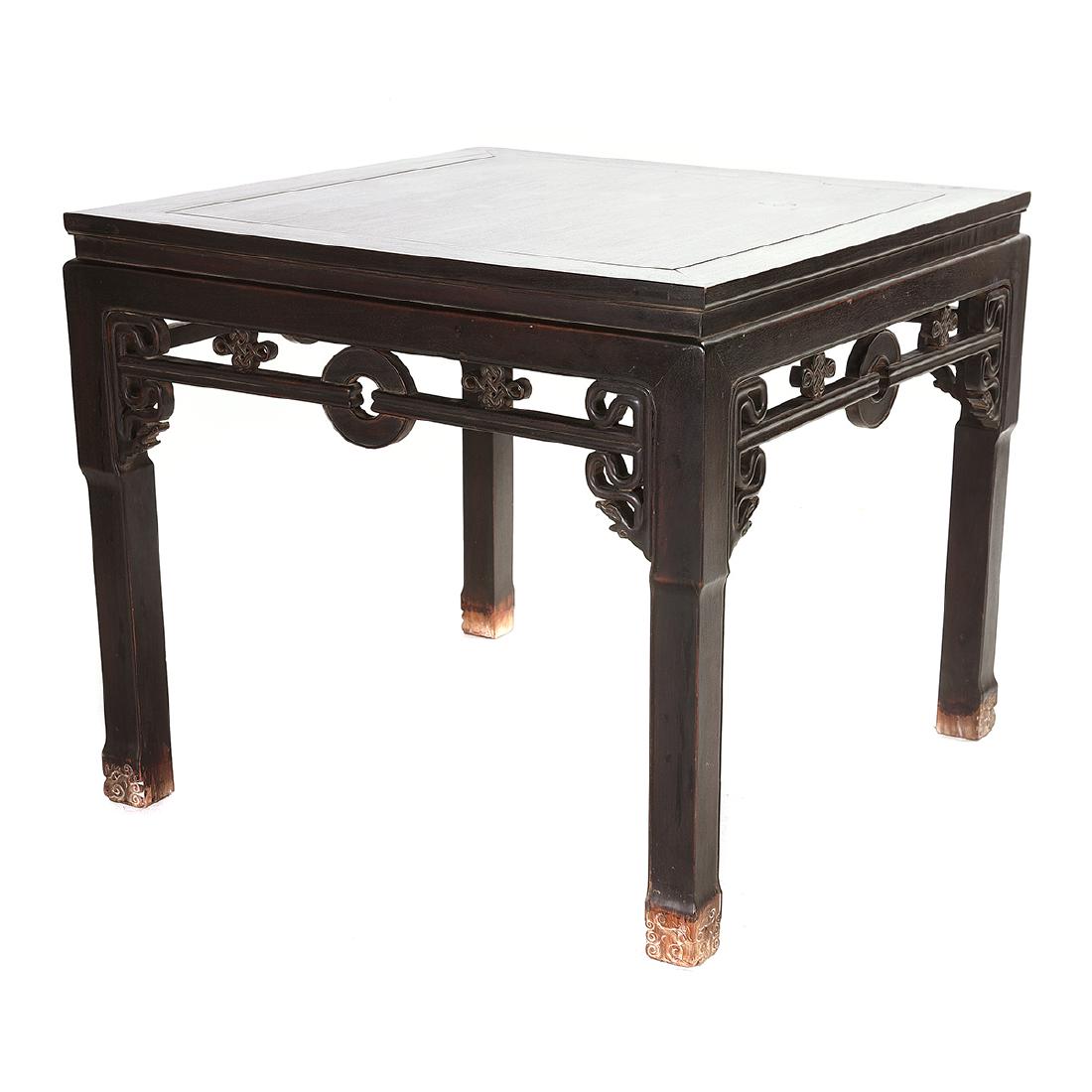 Chinese Rosewood Square Table*: Chinese Rosewood Square Table*. The apron is carved and pierced with dragons, repeating knots, and a central coin medallion, the feet are carved with the face of dragon. {33 1/2 x 39 x 39 inches (85 x