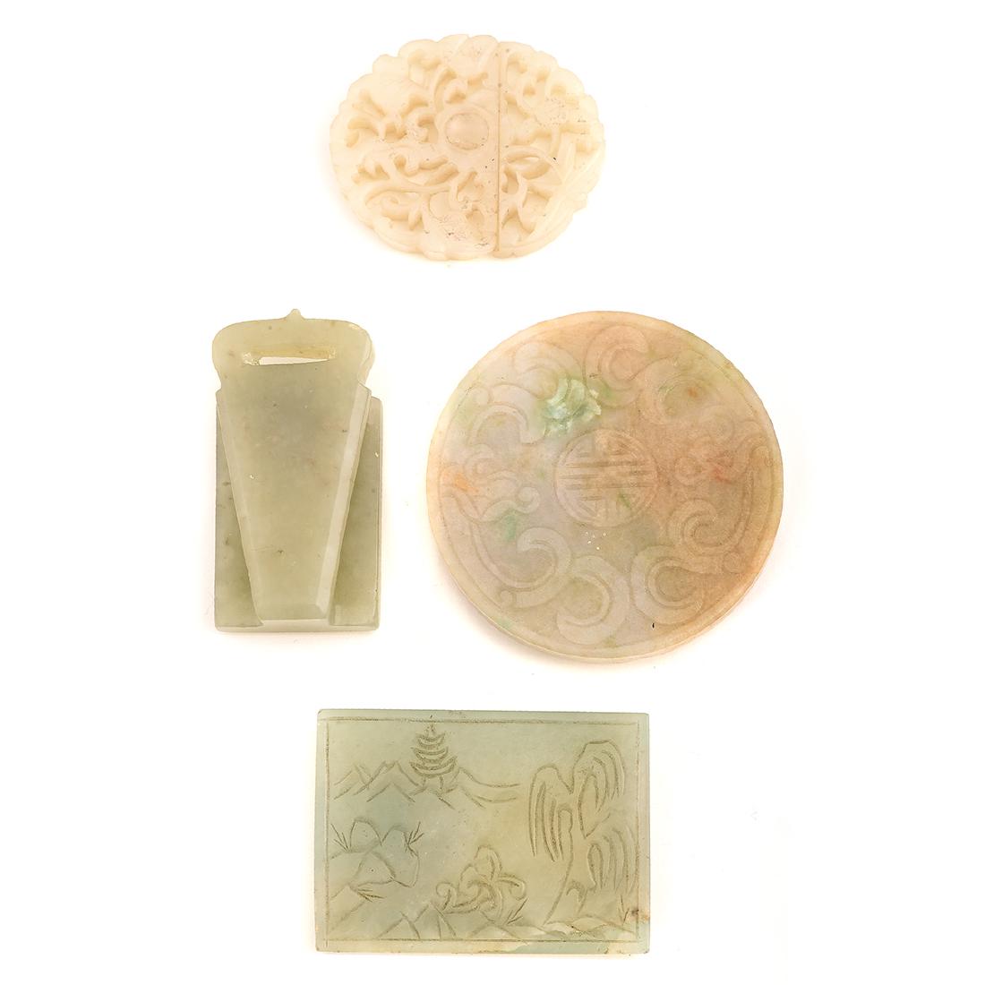 Collection of Four Carved Celdadon Jade Buckles.: Collection of Four Carved Celdadon & Mutton Fat Jade Buckles. Including one ornately carved mutton fat floral motif, two piece buckle measuring approximately 35.5 x 42.6 x 5.2 mm; one carved celadon j