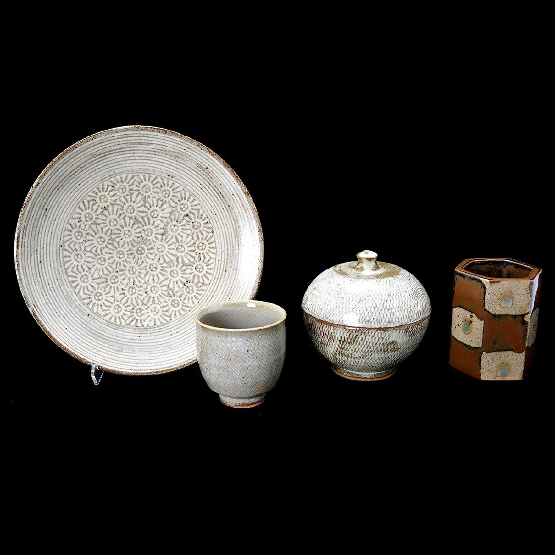 Four Japanese Pottery Vessels: Four Japanese Pottery Vessels. Comprising a hexagonal vase by Shoji Hamada with original signed and seal box, three stonewares, a plate, a cup, and a covered bowl all by Tatsuzo Shimaoka. {Diameter of
