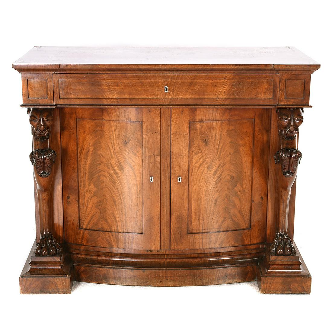 William IV Style Mahogany Secretary Cabinet.: William IV Style Mahogany Secretary Cabinet. Outset surface with a molded edge over a single drawer which opens to reveal a writing surface and three small drawers, set above a bowfront two door cabin