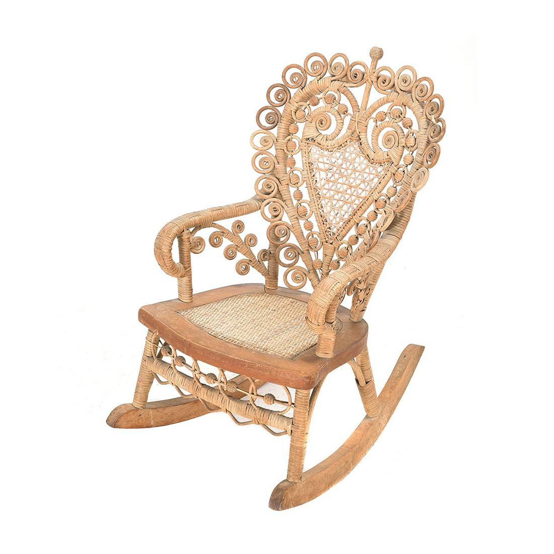 Victorian Hunziger Wicker ChildÃ­s Rocking Chair,: American Victorian Hunziger Wicker ChildÃ­s Rocking Chair. The back of heart shape design. Circa 1890. {Approximate dimensions: 25 high x 15 1/2 wide x 21 1/2 inches deep.}. Condition: Minor losses