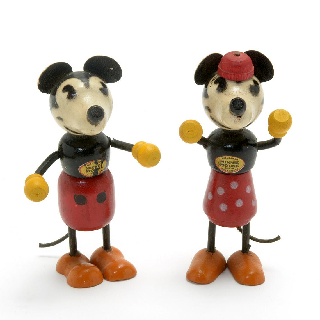 Vintage Carved and Painted Wood and Metal Mickey and: Vintage Mickey and Minnie Mouse Fun-E-Flex Toys. Painted wood body, with metal arms and legs, paper ears and tails. With original stickers on the fronts. Circa 1930. {Approximate dimensions: 3 3/4 inc