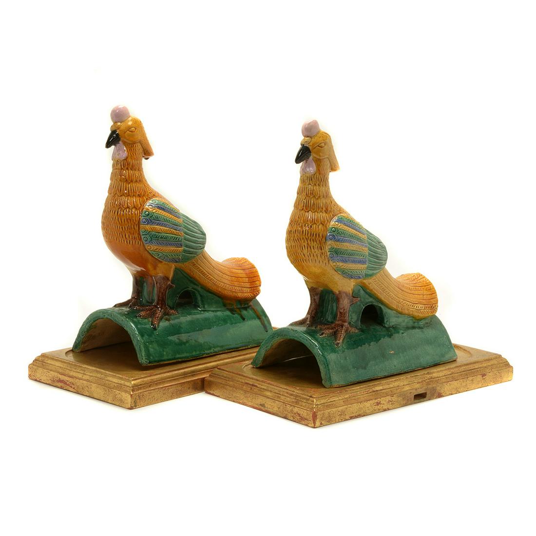 Pair of Chinese Phoenix Form Roof Tiles: Pair of Chinese Phoenix Form Roof Tiles. Sancai-glazed moldeded Phoenix form roof tiles. Each stand on semi-circular shaped tile with fitted wood stand. {Approximate dimensions, 16 x 16 1/2 x 18 3/4 i