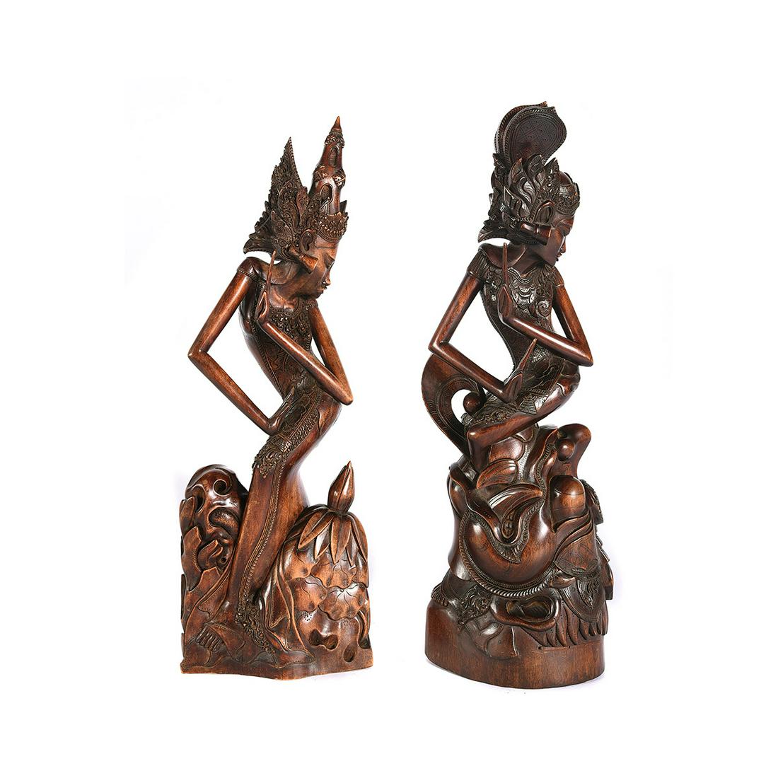 Two Indonesian Carved Wood Statues of Dancers: Two Indonesian Carved Wood Statues of Dancers. Balinese hard wood carving of A Janger dancer. {Approximate height, 20 inches}.