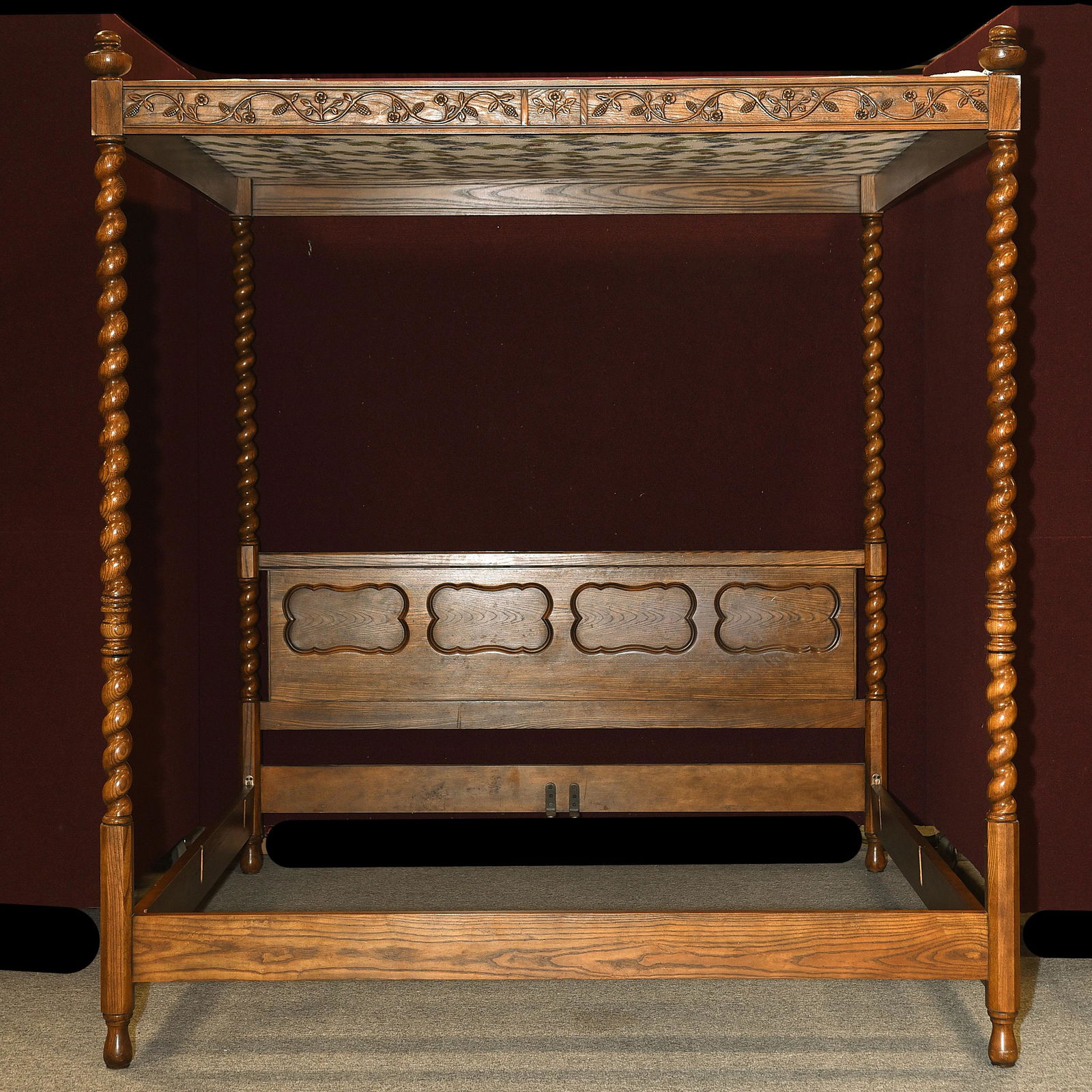 Baker King Size Oak Four Poster Bed Frame.: Baker California King Oak Four Poster Bed Frame. Barley twist supports hold up a white floral vine sheet in a frame with matching carving. Baker Furniture label on the headboard. {Approximate dimensio