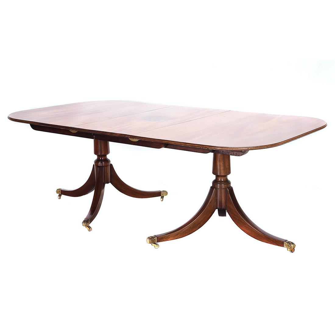 Late 18th Century George III Mahogany Double-Pedestal: Late 18th Century George III Mahogany Double-Pedestal Dining Table. Molded edge, brass-capped claw feet on casters. Two leaves. Late 18th century. {Approximate dimensions: 29 1/2 high x 44 wide x 63 1
