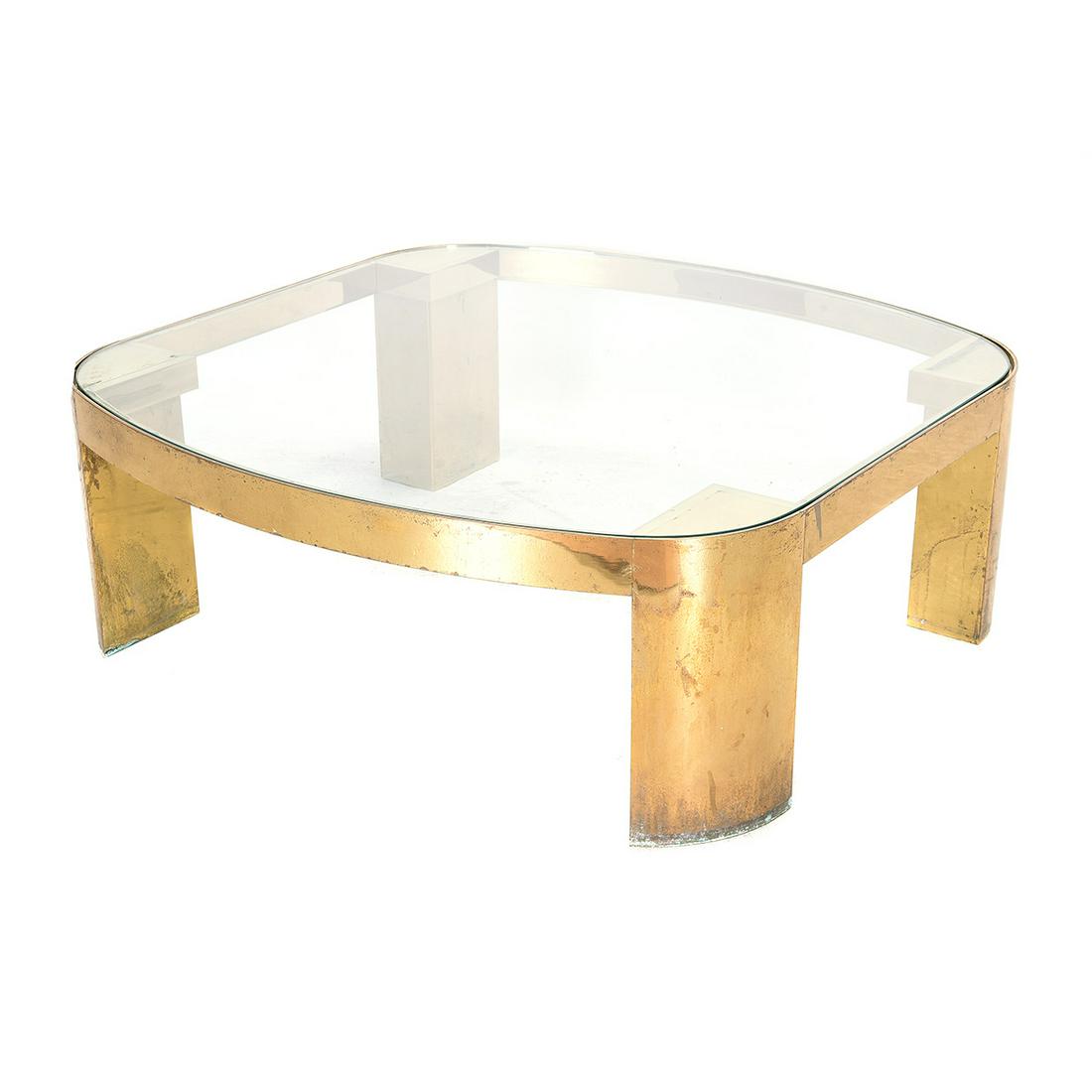 Mid-Century Brass and Glass Coffee Table, Circa 1970's,: Mid-Century Brass and Glass Coffee Table, Circa 1970's, Possibly Karl Springer. Square form with rounded corners and outward curved edges on two sides. Inset glass top supported by wide legs. Circa 19