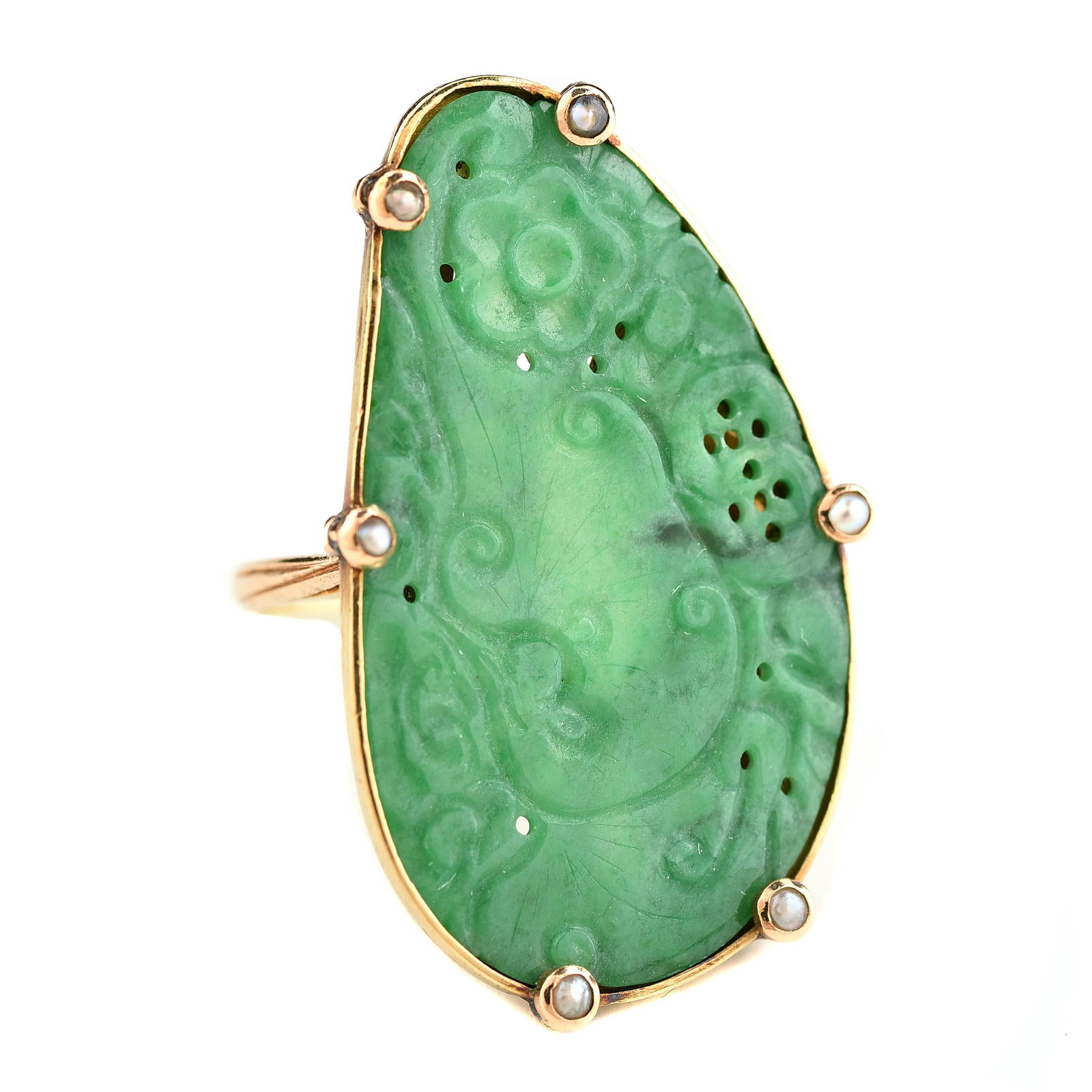 Jadeite Jade, Seed Pearl, 14k Yellow Gold Ring.: Jadeite Jade, Seed Pearl, 14k Yellow Gold Ring. Featuring one carved and pierced kidney shaped jadeite jade plaque measuring approximately 31 x 18 mm, surrounded by six seed pearls, set in a 14k yello