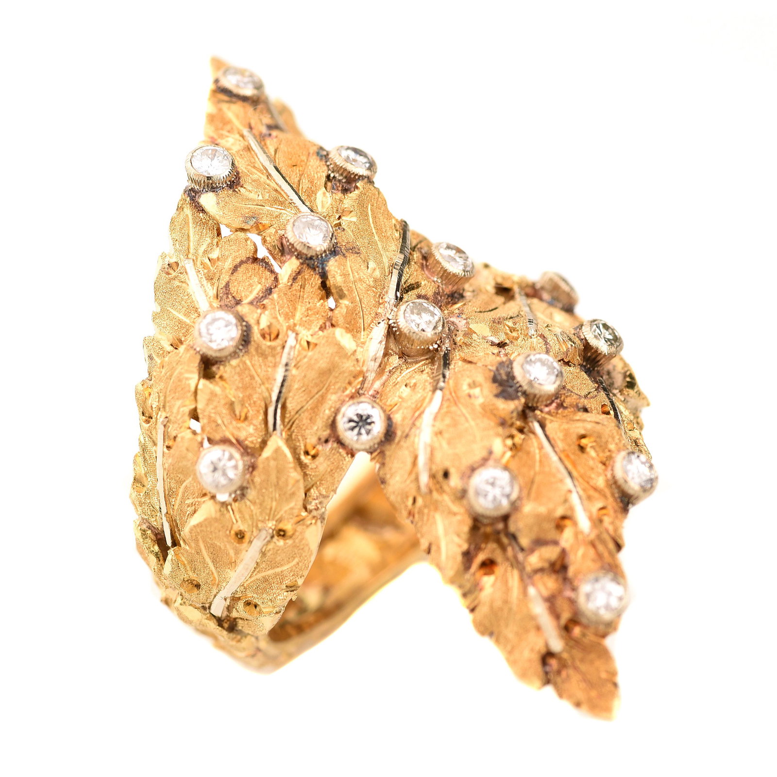 Buccellati Diamond, 18k Yellow Gold Leaf Ring.: Buccellati Diamond, 18k Gold Leaf Ring. Featuring fifteen round brilliant-cut diamonds weighing a total of approximately 0.50 cttw., set in an 18k yellow and white gold leaf motif bypass mounting. {Si