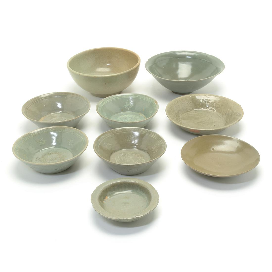 Group of Ten Korean Celadon Glaze Dishes and Bowls.: Group of Ten Chinese and Korean Celadon Glaze Dishes and Bowls. In various size and shapes. {Approximate diameter of largest, 7 1/4 inches}.