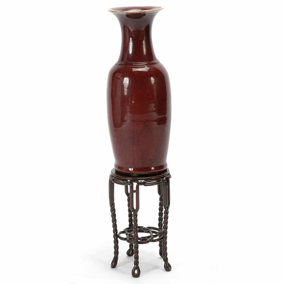 Ox Blood Baluster Vase and a Carved Rosewood Stand.: Chinese Ox Blood Baluster Vase and A Carved Rosewood Stand. The baluster vase with a trumper mouth, typically entirely covered in a rich ox-blood glaze. togerther with a tall cared rosewood stand with