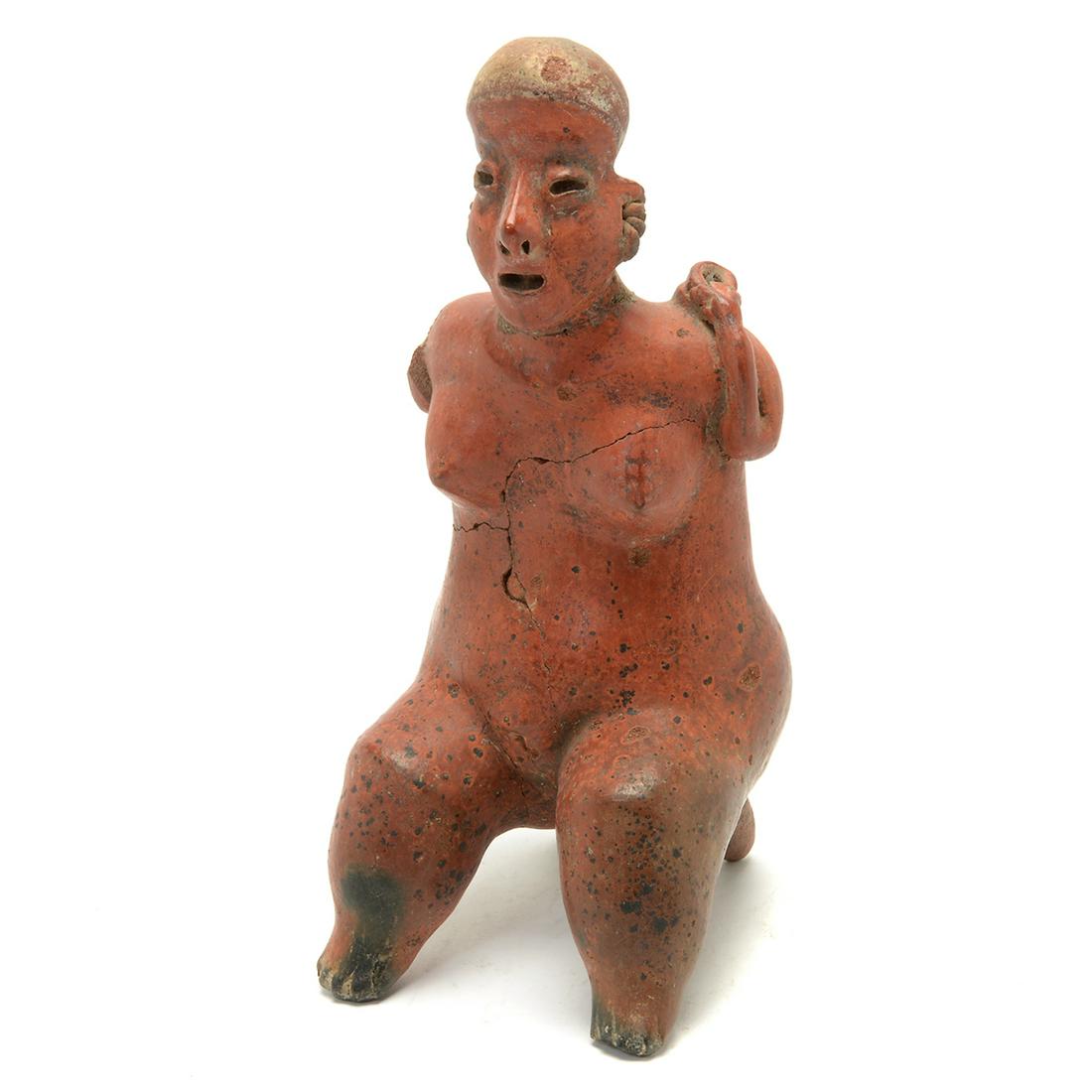 Pre-Columbian Olmec Red Earthenware Goddess or: Pre-Columbian Olmec Red Earthenware Goddess or Fertility Figure. Seated nude female figure, red glaze. {Approximate dimensions: 12 3/4 high x 5 1/4 wide x 6 inches deep.}. Condition: Loss to arm, crac