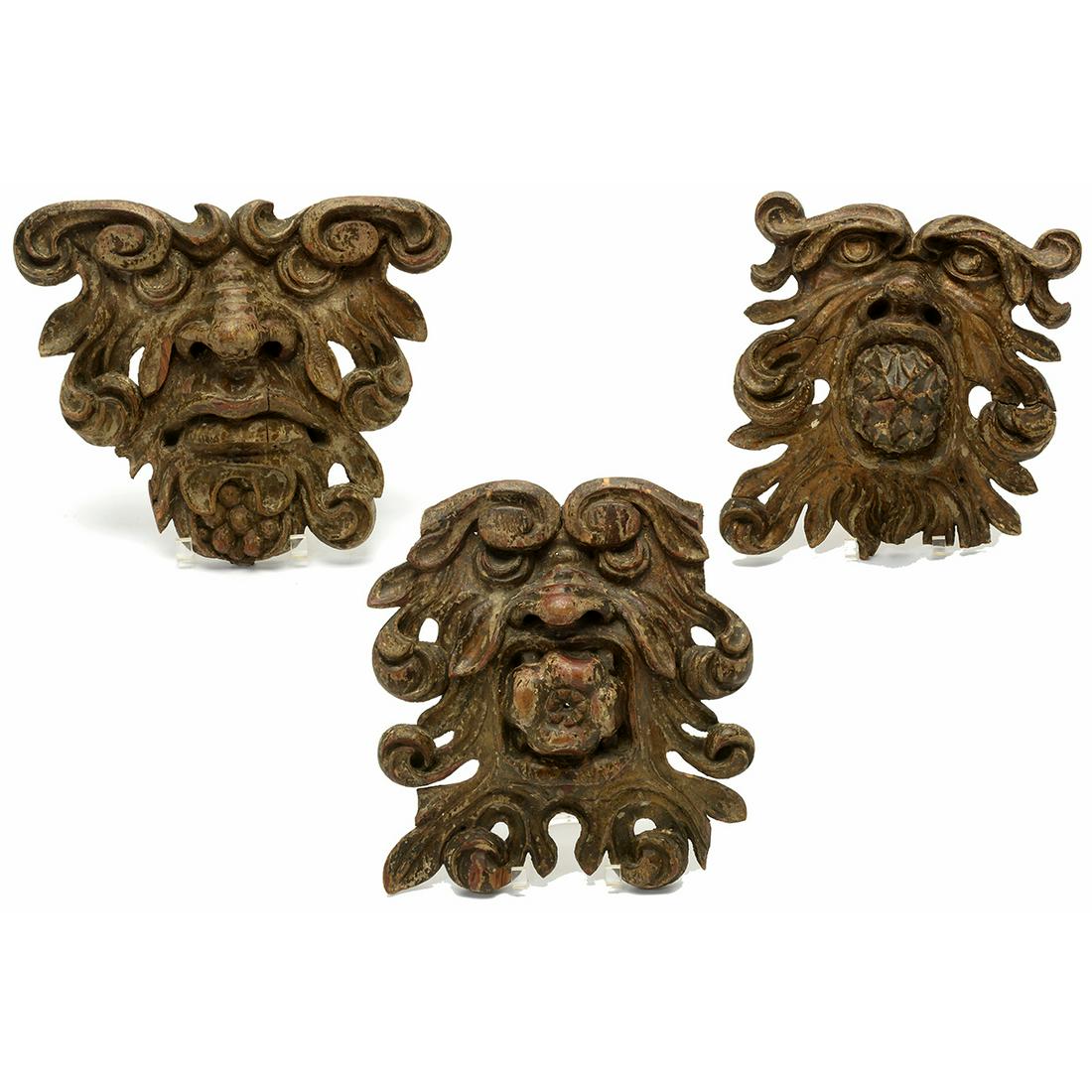 Three Baroque Style Giltwood Grotesque Masks.: Three Baroque Style Giltwood Grotesque Masks. One with a pineapple in its mouth, another with a pomegranate, and one with a frown. Late 19th century or older. {Approximate dimensions: Pineapple 14 1/2