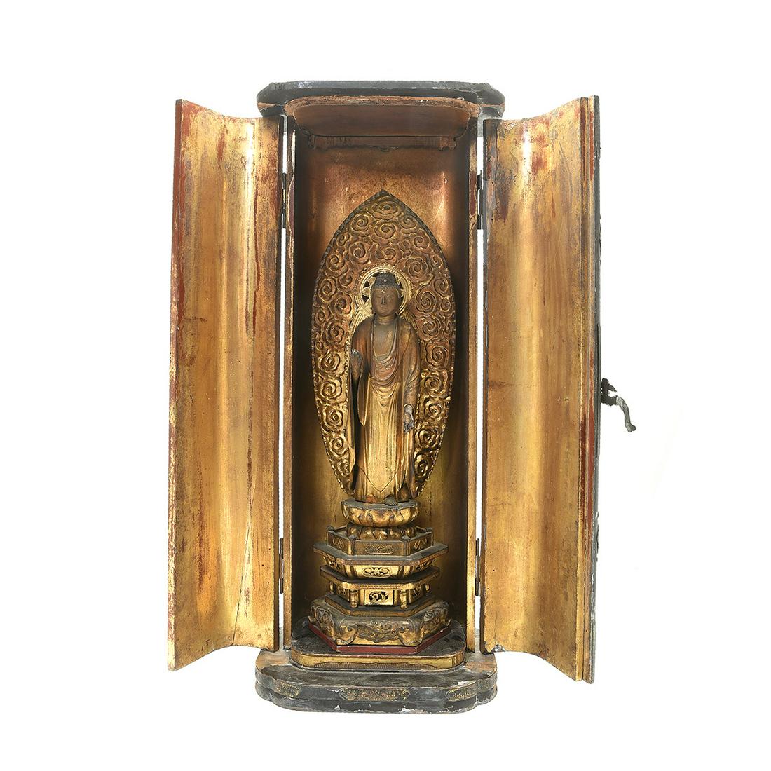 Japanese lacquer shrine with standing Buddha: Japanese lacquer shrine with standing Buddha. The wood, gold-leaf, and lacquer zushi (small Buddhist shrine) shrine with hinged double doors opening to reveal a gilt-painted standing Bodhisattva, Senj