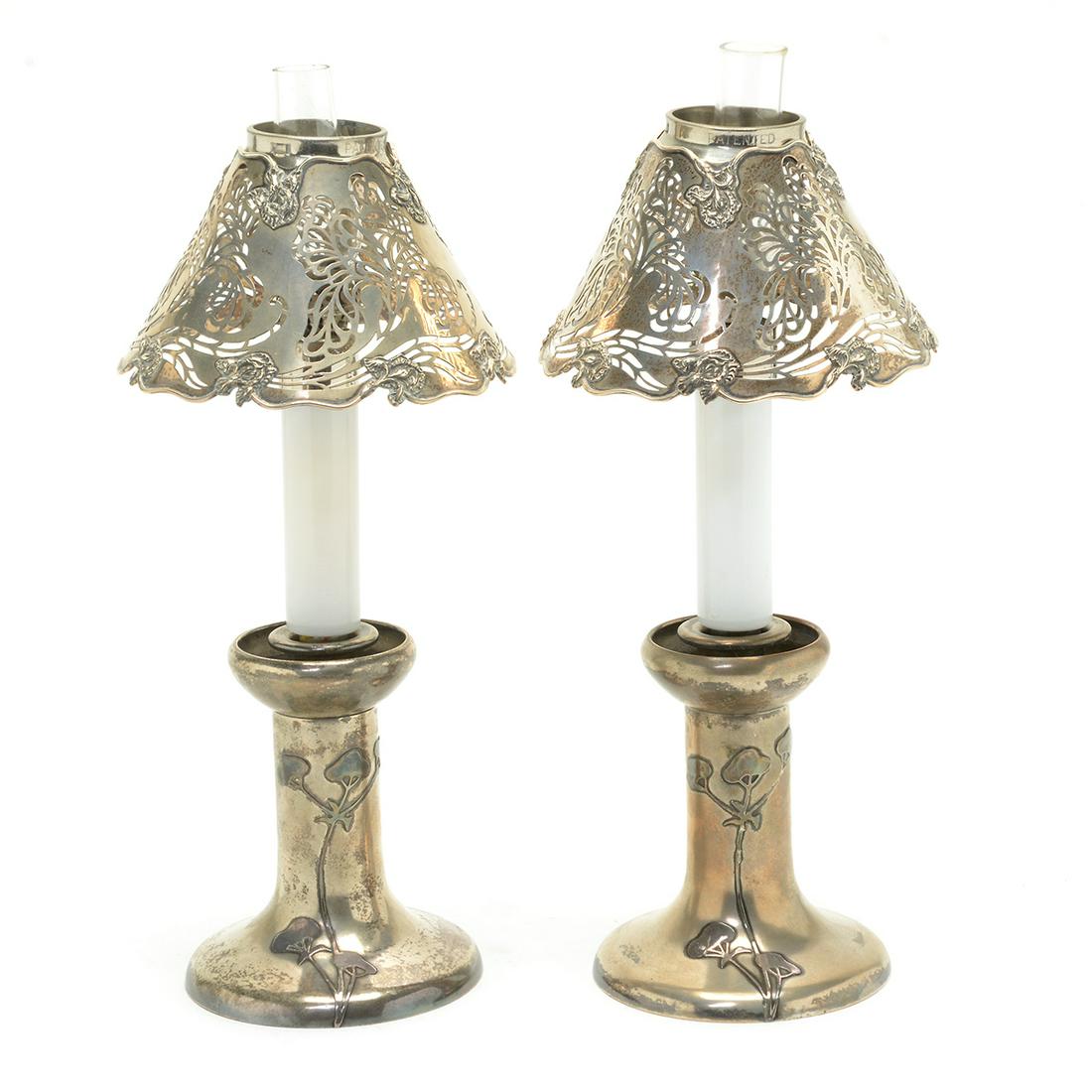 Pair of Sterling Silver Art Nouveau Style Table: Art Nouveau Heintz Sterling on Bronze Pair of Table Lanterns. Silver-plated bases with easily removeable candle form lamps, and Shreve sterling Art Nouveau shades. Bases marked '3108, HAMS in diamond 