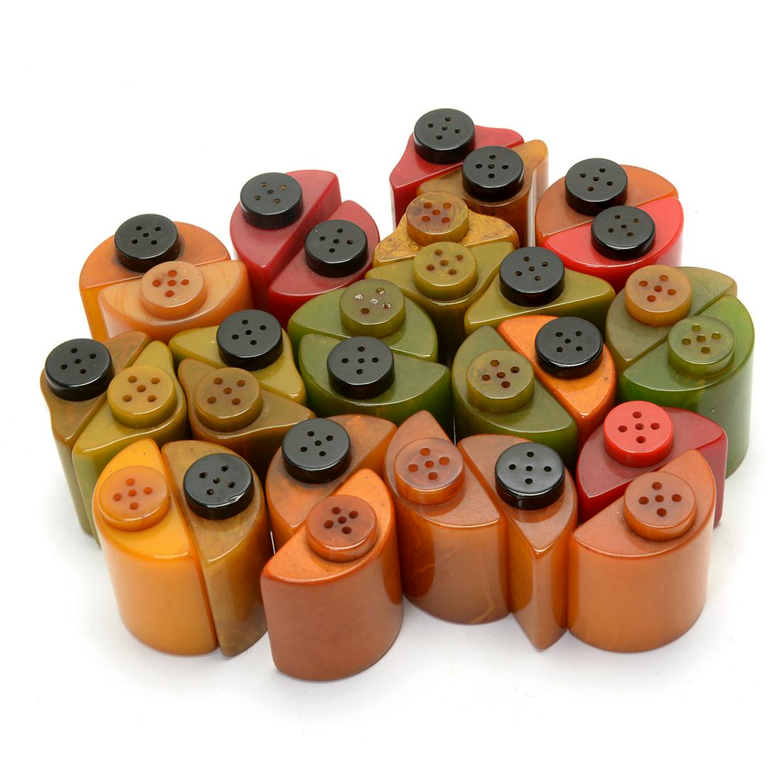 Mid Century Group of Bakelite Salt and Pepper Shakers,: Mid Century Group of Bakelite Salt and Pepper Shakers, Various Colors and Shapes. 29 pieces total. Most are demilune in form, forming a whole circle when paired. Some pieces are without a match. Condi