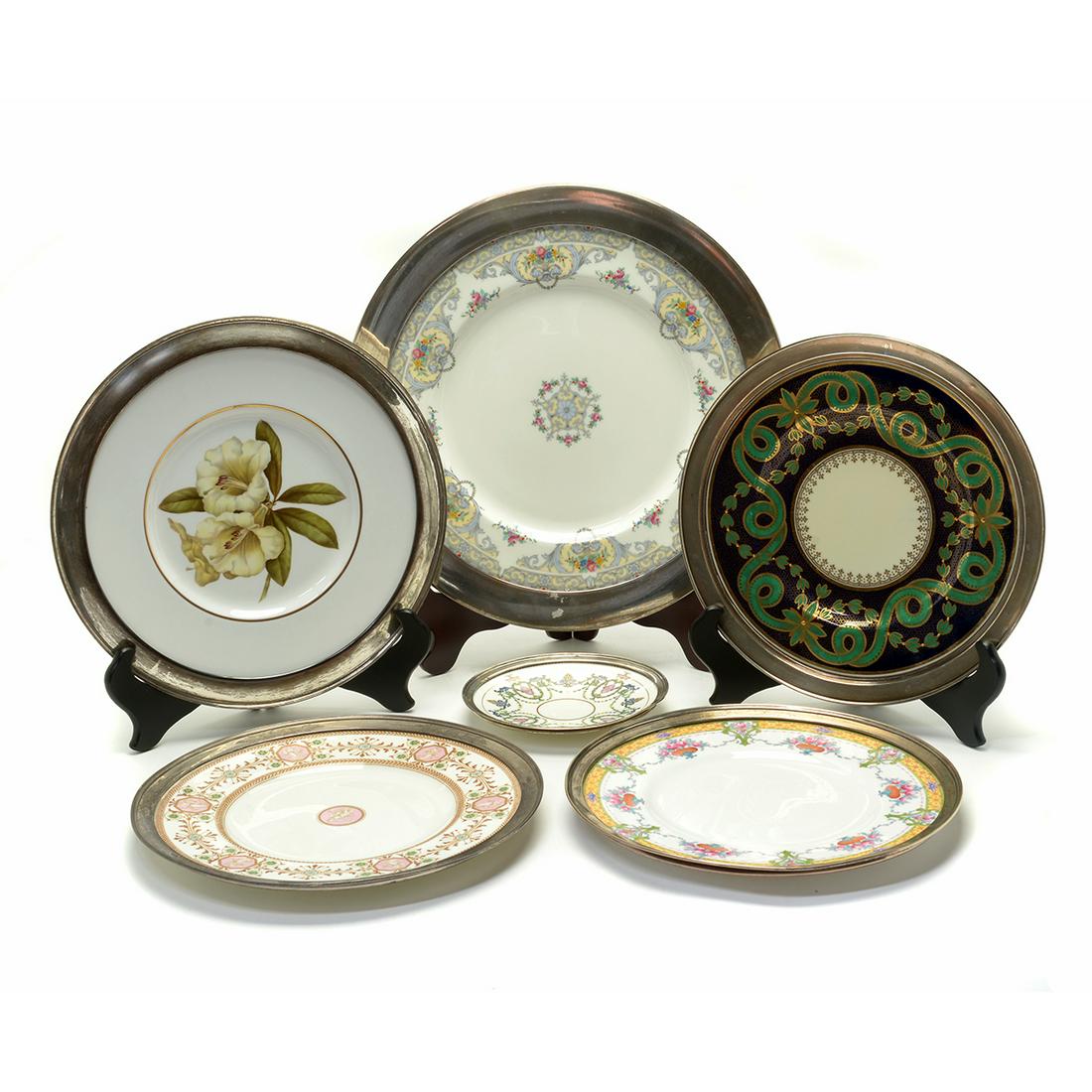 Six Continental Porcelain Decorative Plates with: Six Continental Porcelain Decorative Chargers and Plates with Sterling Silver Rims, Including Wedgwood and Copeland. Comprising a Mintons Shellbourne pattern charger with Shreve sterling rim, Wedgwood