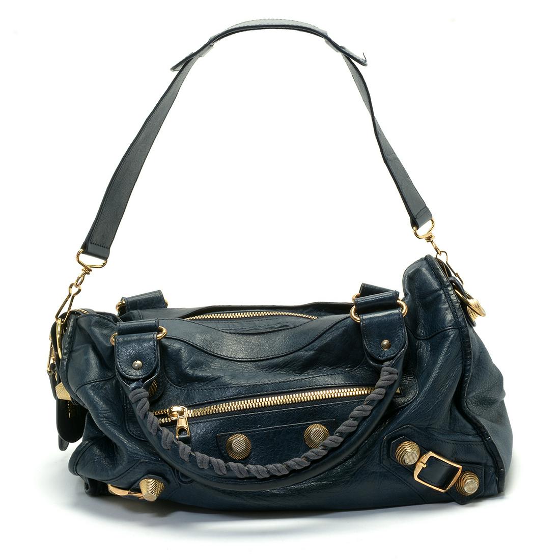 Balenciaga Blue Leather City Bag.: Balenciaga Blue Leather City Bag. Two loop handles, dark blue leather with gilt metal mountings. Embossed leather Balenciaga Paris label to the interior. {Approximate dimensions: 11 high x 15 inches w