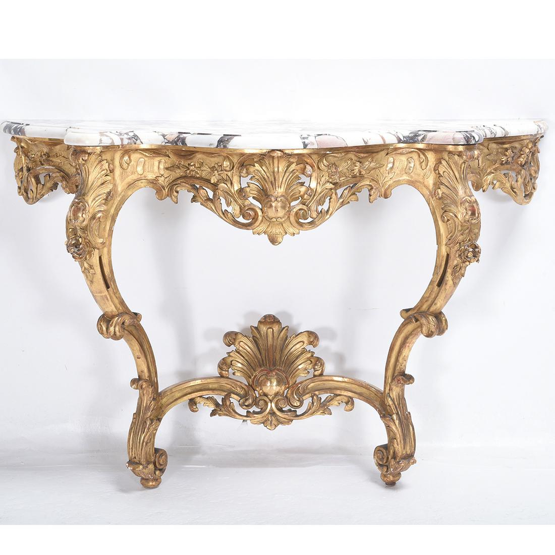 Rococo Style Giltwood Console Table.: Rococo Style Giltwood Console Table. Foliate carved frame, white and red marble top. {Approximate dimensions: 37 high x 57 wide x 22 inches deep}. Condition: Wear to the gilt finish, several small chi