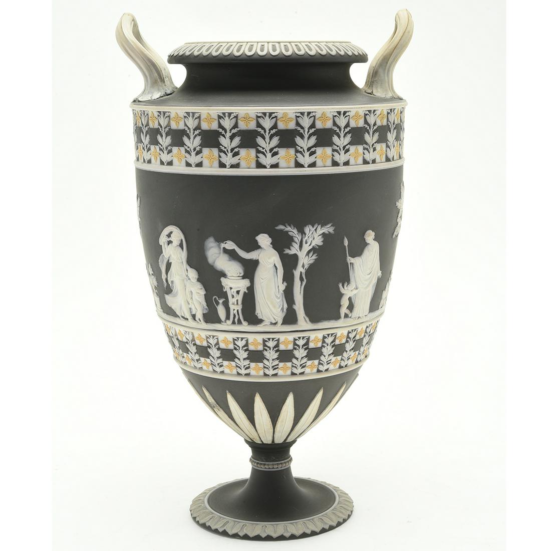 Wedgwood PotteryThree Color Jasper Dip Dice Border Urn.: Wedgwood PotteryThree Color Jasper Dip Dice Border Urn. White and yellow on a basalt ground, two handles. Impressed with Wedgwood to the underside. Circa 1820. {Approximate dimensions: 11 high x 6 1/4