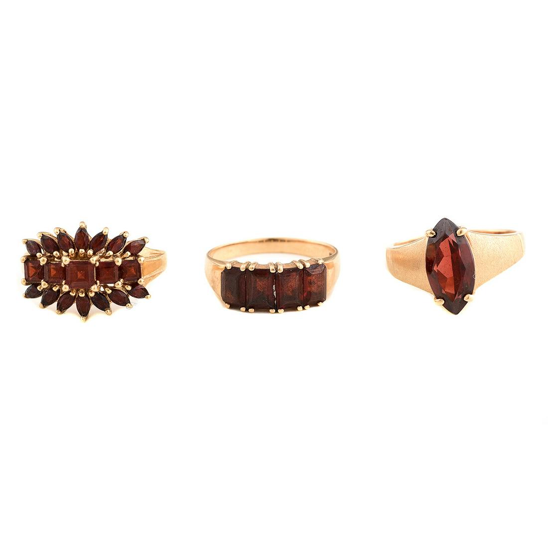 Collection of Three Garnet, Yellow Gold Rings. (1 of 3)