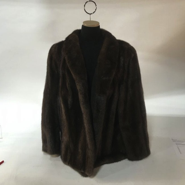 Mink Coat: Brown Mink Coat. With a single breasted shawl collar, exterior pockets on both sides, 'LCC' monogram to the interior. {Approximate dimensions: 33 long, 22 armpit to armpit, 26 inch sleeves.}. Conditio