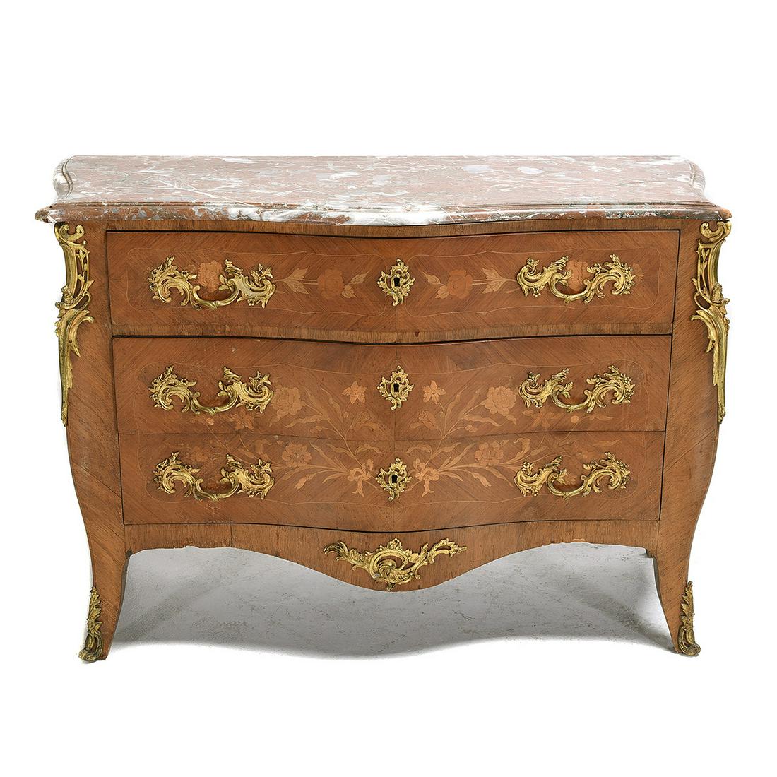Louis XVI Style Marble Top Inlaid BombÃ‹ Commode.: Louis XVI Style Marble Top Inlaid BombÃ‹ Commode. Red and gray beveled marble top over three long drawers, saber legs. Floral inlaid decoration to drawers and sides, gilt metal mounts. {Approximate
