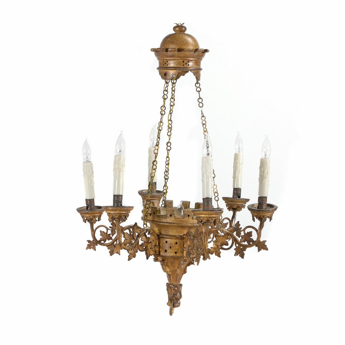 Louis Philippe Neo-Gothic Giltwood Six Light: Louis Philippe Neo-Gothic Giltwood Six Light Chandelier. The gilt carved corona, suspending link chains, above a conforming crown form urn, issuing six upswept scrolling arms, embellished with leafy s