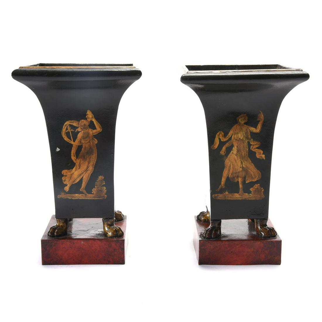Pair of Directoire Style Tole Vases.: Pair of Directoire Style Tole Vases. Each ebonized square form, the front with a gilt decorated decaled figure of a Muse, two sides with a gilt decaled musical trophy; raised on gilt paw feet, atop a 