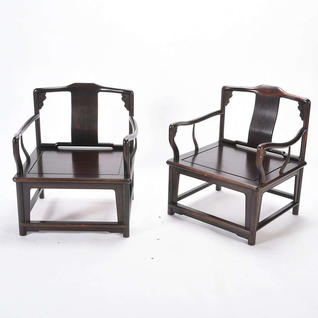 Pair of Chinese Rosewood Armchairs*: Pair of Chinese Rosewood Armchairs* Pair Chinese rosewood arm chairs with curved arms. {Height: 28 1/2 inches, width: 28 1/2 inces, depth 28 1/2 inches}.