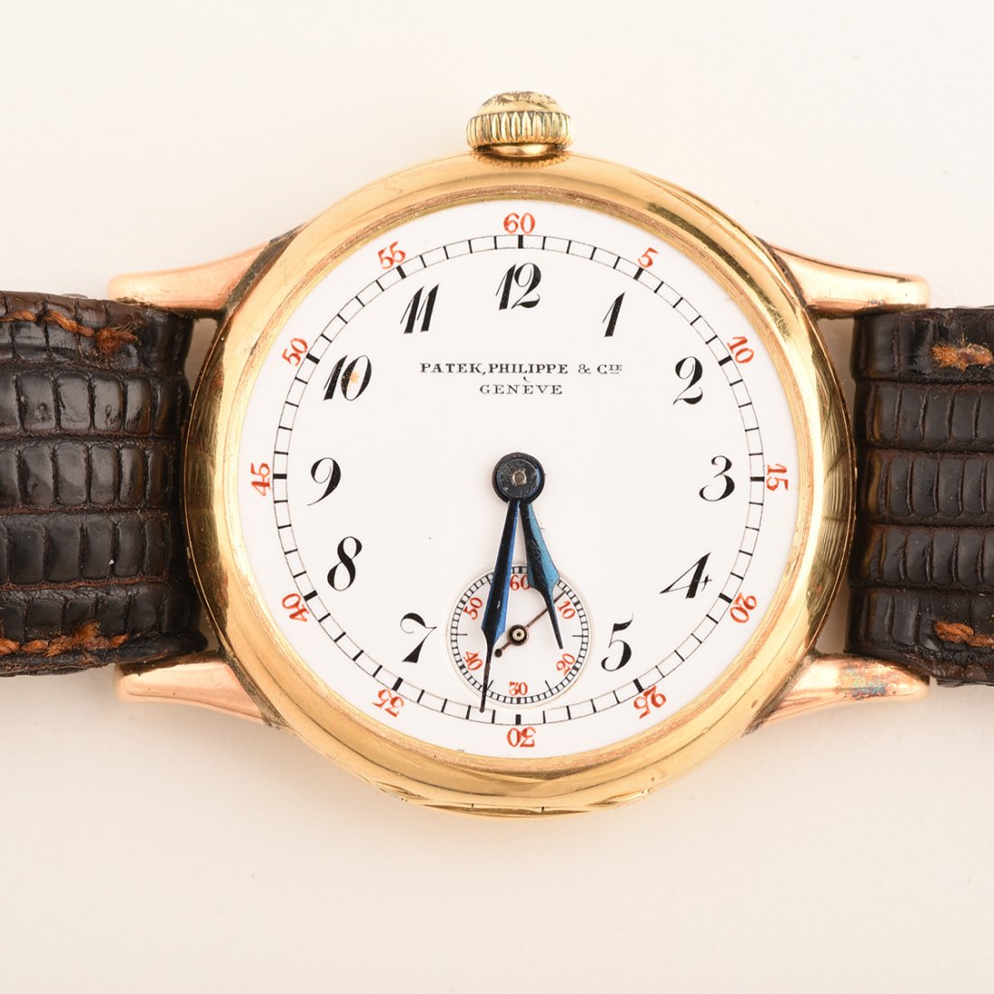 Patek Philippe 18k Yellow Gold, Leather Transitional: Patek Philippe 18k Yellow Gold, Leather Transitional Wristwatch. DIAL: Round, white, black Arabic numeral hour markers, black outer minutes track, red outer five interval markers, sunken subsidiary se