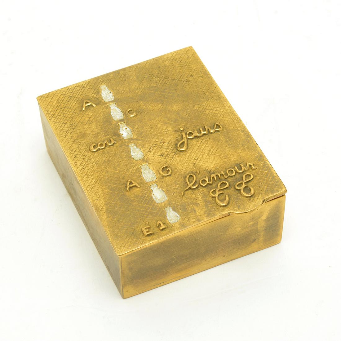 Line Vautrin Gilt Bronze and Enamel Rebus Box, 1943.: Line Vautrin Gilt Bronze and Enamel Rebus Box, 1943. The rectangular box moulded with tab to textured cover. Enameled in white with seven bottles of milk in vertical line between the letters A / G/ Co